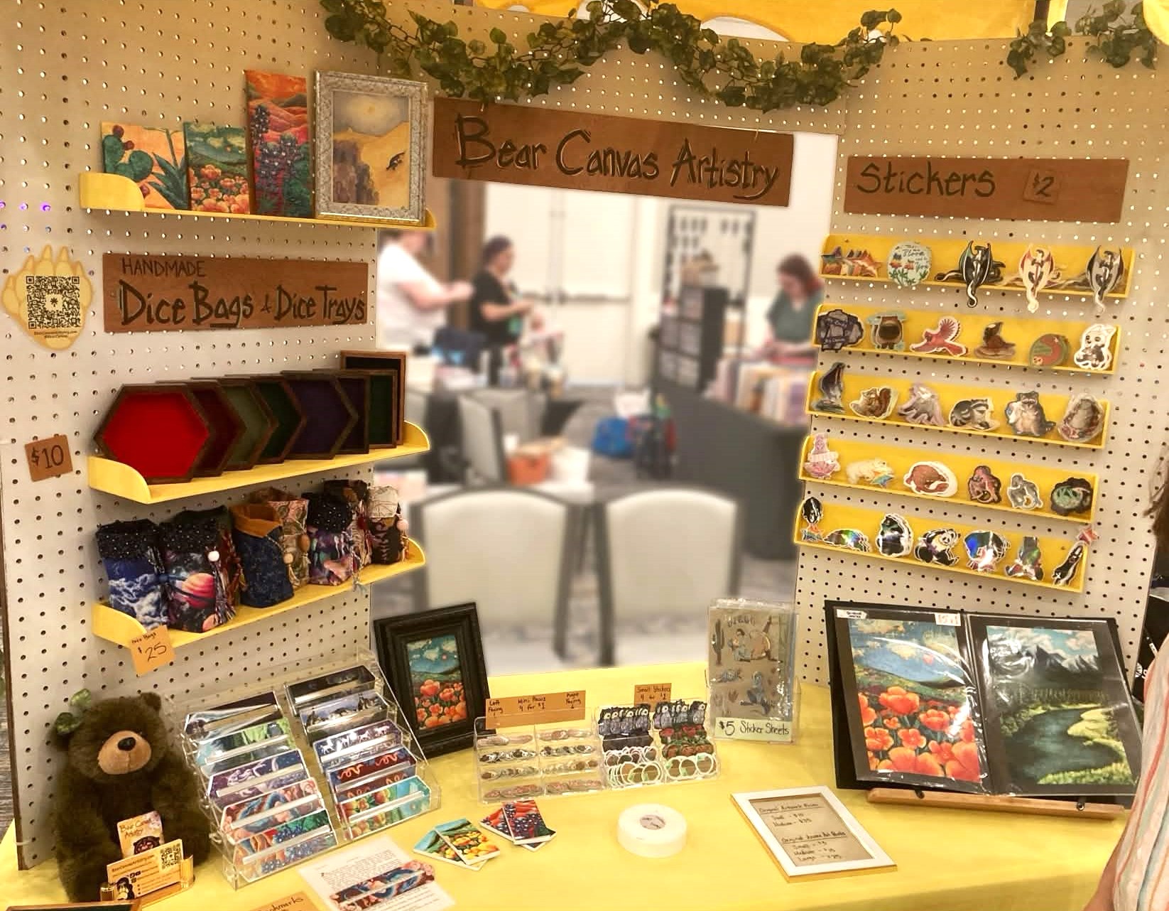 A picture of Bear Canvas Artistry's booth setup.